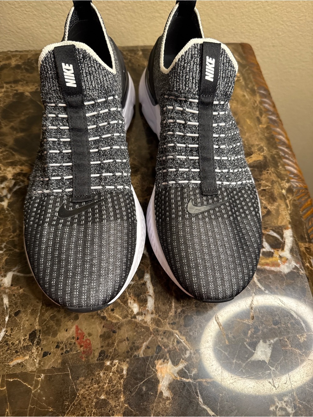 Nike Men’s Black and White Knit Slip-On Sneakers